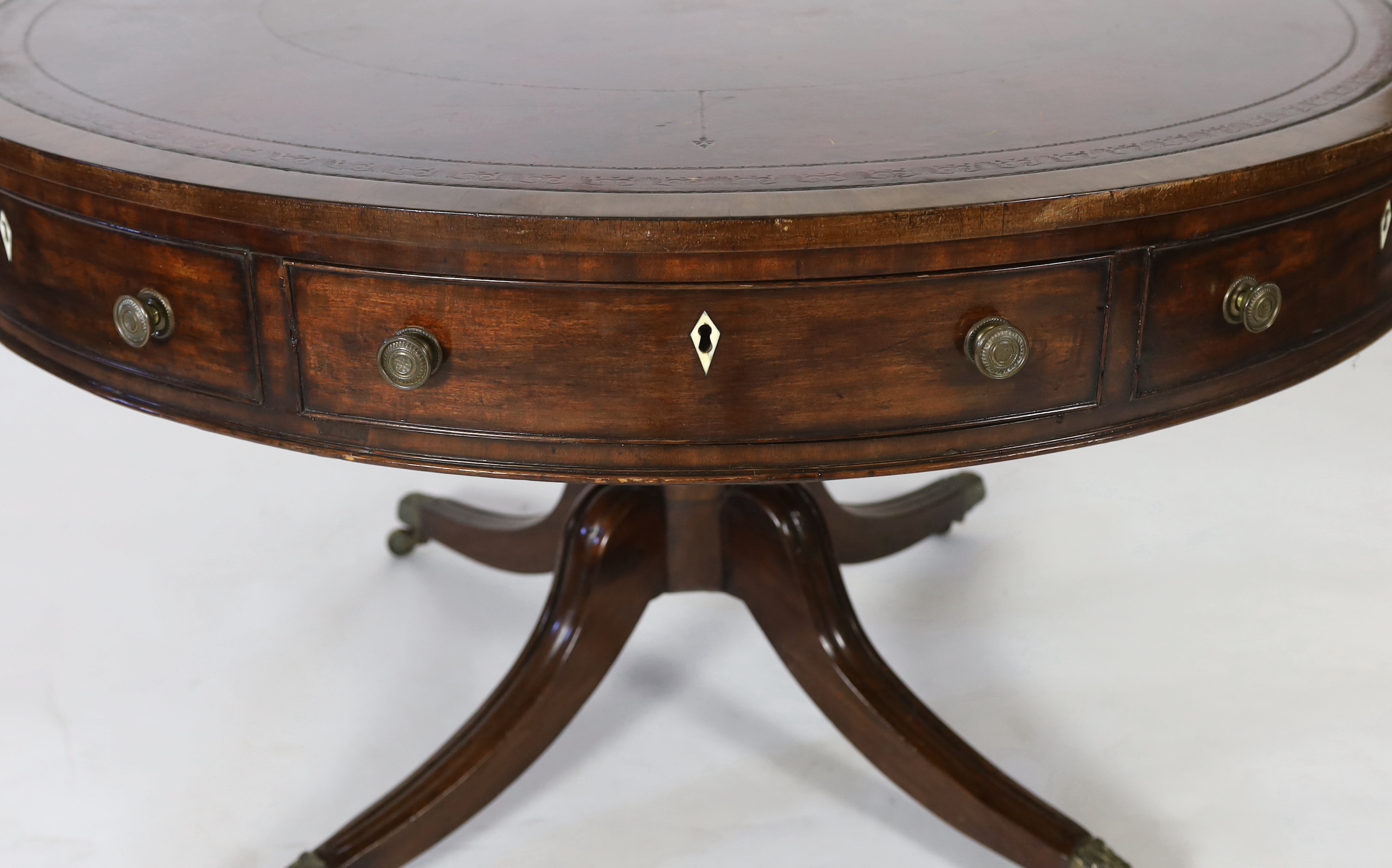 A Regency mahogany drum top library table